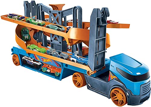 Hot Wheels GNM62 - City Mega Action Transporter mit Platz für bis zu 20 Fahrzeuge im Maßstab 1:64, mit Aufzug- und Starter-Funktion und 1 Hot Wheels Fahrzeug, ab 3 Jahren von Hot Wheels