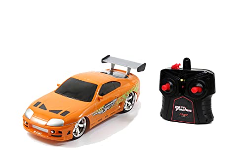 Jada 7/253203021 Toys Fast & Furious RC Auto Brian's Toyota Supra, ferngesteuertes Auto mit 2-Kanal Funksteuerung, Turbofunktion, fährt vorwärts-rückwärts, links-rechts, Maßstab 1:24, ab 6 Jahren, orange von Jada Toys