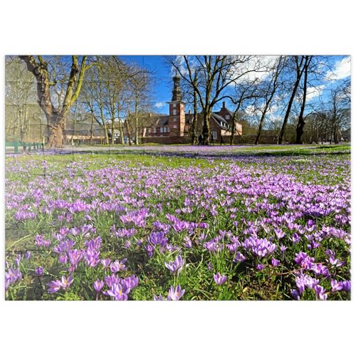 MyPuzzle Krokusblüte im Schlosspark mit dem Schloss vor Husum - Premium 100 Teile Puzzle - MyPuzzle Sonderkollektion von Puzzle Galaxy von MyPuzzle.com