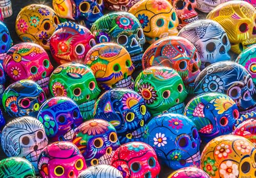 Springbok Das 1000-teilige Puzzle "Sugar Skulls" für Erwachsene ist eine erstaunliche bunte Darstellung von bemalten Totenköpfen oder Calaveras – traditionelle mexikanische Volkskunst. von Springbok