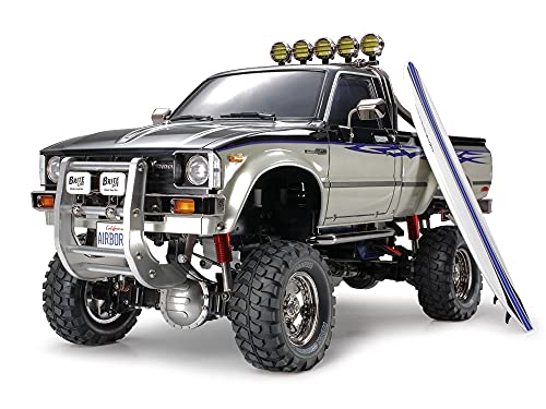 TAMIYA TMYTAM58397 1:10 RC Toyota HiLux HighLift 4x4 3-Gang - ferngesteuertes Auto - inkl. Surfbrett - Offroad - Pick Up -Elektromotor - Modellbausatz - Metallgetriebe - unlackiert - 58397, Schwarz TAMIYA TMYTAM58397 1:10 RC Toyota HiLux HighLift 4x4 3-Gang - ferngesteuertes Auto - inkl. Surfbrett - Offroad - Pick Up -Elektromotor - Modellbausatz - Metallgetriebe - unlackiert - 58397, Schwarz von TAMIYA