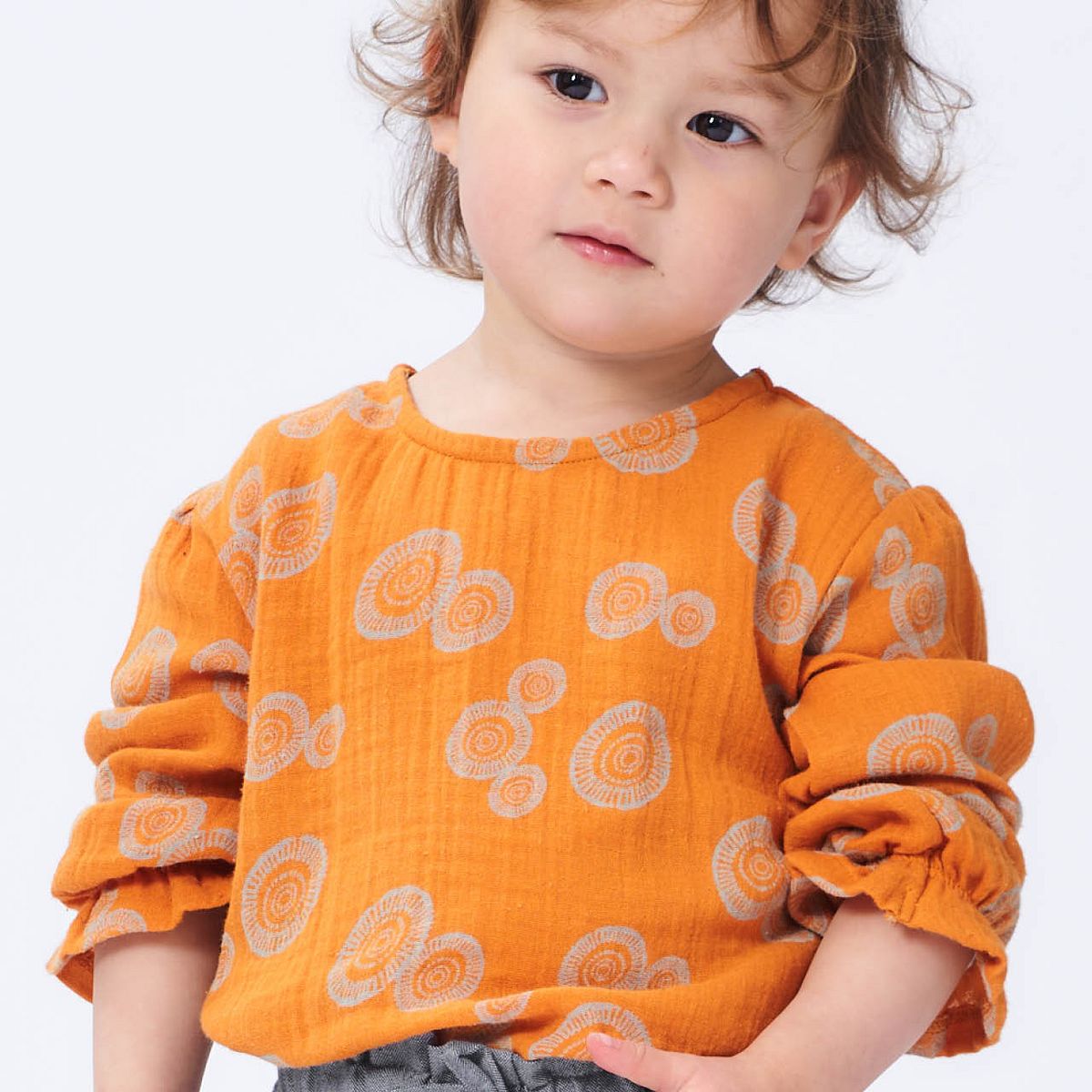Rüschen Musselin Langarmshirt Kreise rost-orange 122 Rüschen Musselin Langarmshirt Kreise rost-orange 122